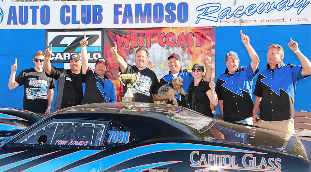 Tony Jurado and his crew with his trophy for winning the 6.9 slammer class