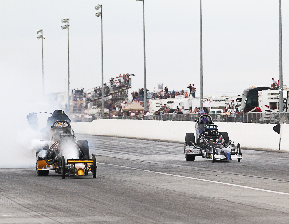 Tony Bartone fries his pistons at the finish line to win the Top Fuel title